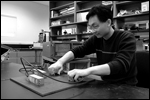 Wei "Louie" Luo performs a thickness measurement study using ultrasonic waves generated by electromagnetic acoustic transducers (EMATs).